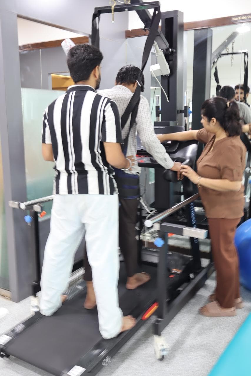Patient training on a robotic gait trainer with therapist support
